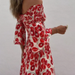 Smockad off shoulder långklänning med fickor och blommigt tryck