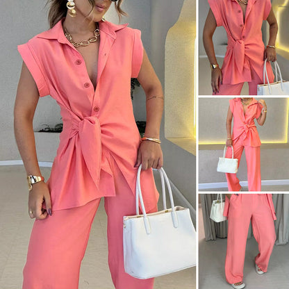 Elegant set med ärmlös blus och löst sittande byxor med hög midja