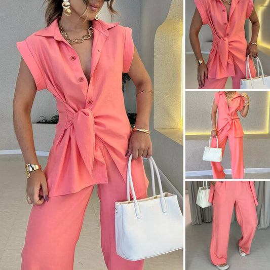 Elegant set med ärmlös blus och löst sittande byxor med hög midja