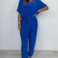 V-ringad enfärgad jumpsuit med lös midja för kvinnor