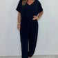 V-ringad enfärgad jumpsuit med lös midja för kvinnor