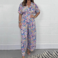 Elegant V-ringad jumpsuit med tryck och vida ben för kvinnor