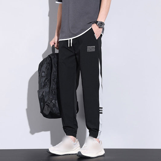 Trendiga joggers i issilke för män med fickor