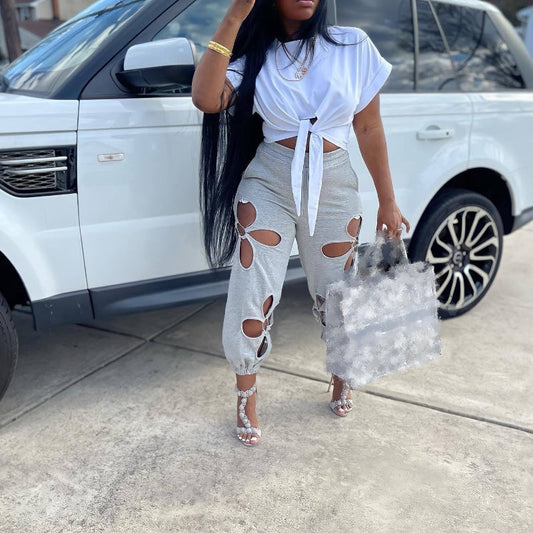 Fritidsbyxor för kvinnor med slitna hål