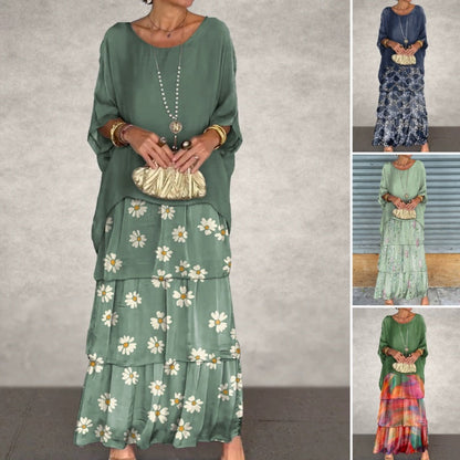 Elegant klänning med rund halsringning, nätmaterial och blommönster i flera lager