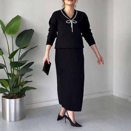 Elegant tvådelat set med tröja och kjol med strassrosett för kvinnor