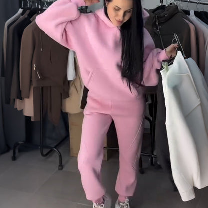 Tvådelad träningsoverall med huva för damer