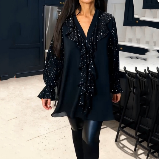 Damtröja med V-ringning, paljetter och volangkant