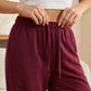 Casual sweatpants för damer med vid ben och dragsko