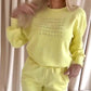 Bekvämt set med sweatshirt och byxor med rund hals