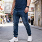 Joggingbyxor i denim med smal passform för herr, med fickor med dragkedja