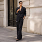 Set med elegant damblazer och byxor med vida ben