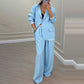 Set med elegant damblazer och byxor med vida ben