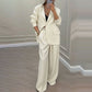 Set med elegant damblazer och byxor med vida ben