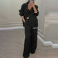 Set med elegant damblazer och byxor med vida ben