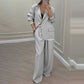 Set med elegant damblazer och byxor med vida ben