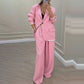 Set med elegant damblazer och byxor med vida ben
