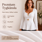 Damtopp med V-ringning och peplum med blommotiv