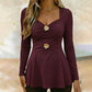 Damtopp med V-ringning och peplum med blommotiv