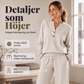 Enkel kvinnlig set med topp och vida byxor