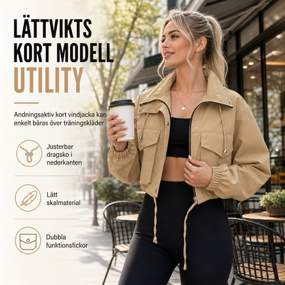 Kvinnlig vindjacka i enfärgad med kort dragkedja, höstkappa